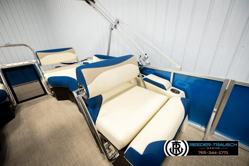 Slide: The Image of Luxurious seating on 2026 Avalon LSZ QLS pontoon boat, featuring blue and cream upholstery. - 20