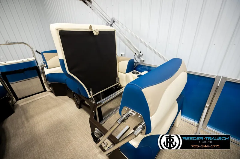 Slide: The Image of 2026 Avalon LSZ QLS boat interior with blue and beige seating, showcased by Reeder Trausch Marine. - 22