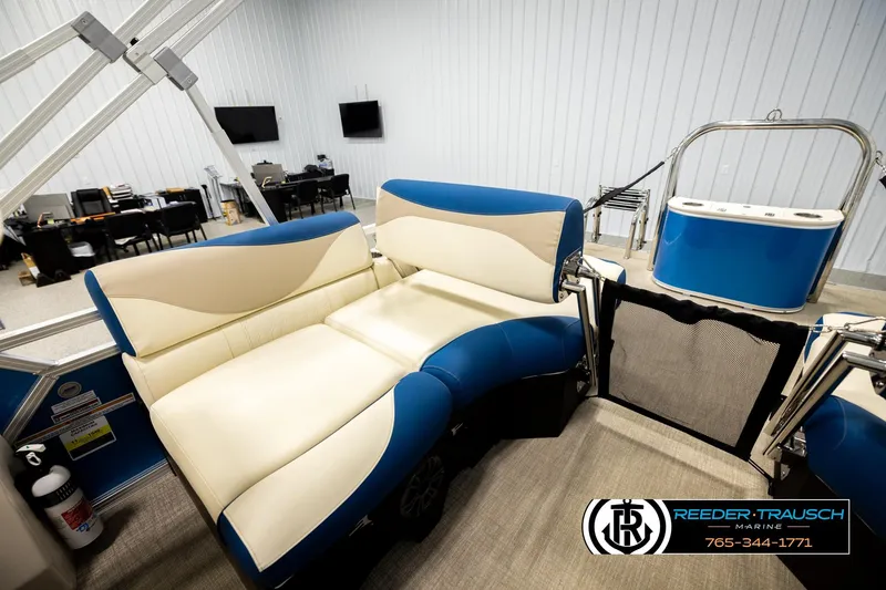 Slide: The Image of Luxurious 2026 Avalon LSZ QLS boat interior with blue and beige seating in a showroom. - 25