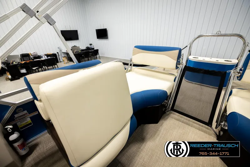 Slide: The Image of 2026 Avalon LSZ QLS boat interior with blue and white seating, showroom setting. - 27