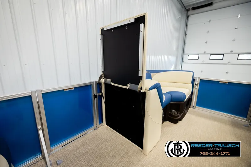 Slide: The Image of 2026 Avalon LSZ QLS boat interior with blue and white seating in a garage setting. - 29