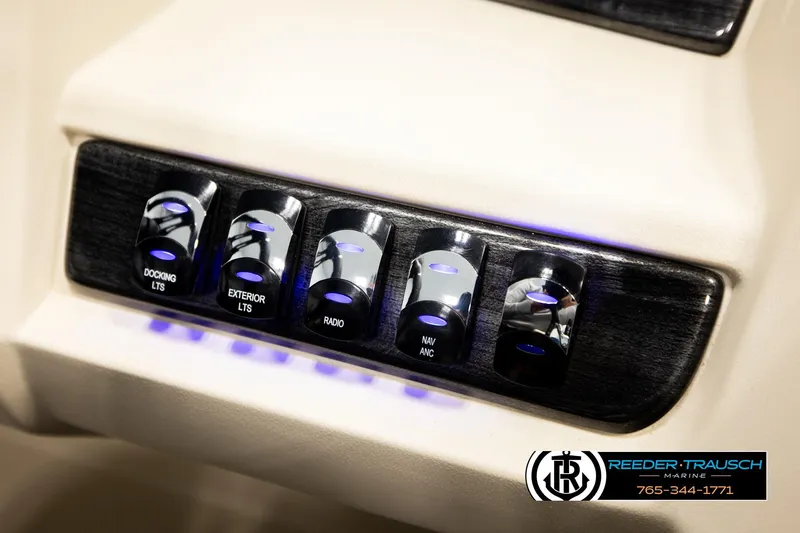 Slide: The Image of Control panel of 2026 Avalon LSZ QLS boat with illuminated switches for docking, exterior lights, and radio. - 40