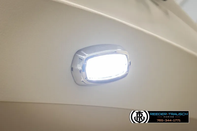 Slide: The Image of LED light on 2026 Avalon LSZ QLS boat, Reeder-Trausch Marine logo visible. - 43