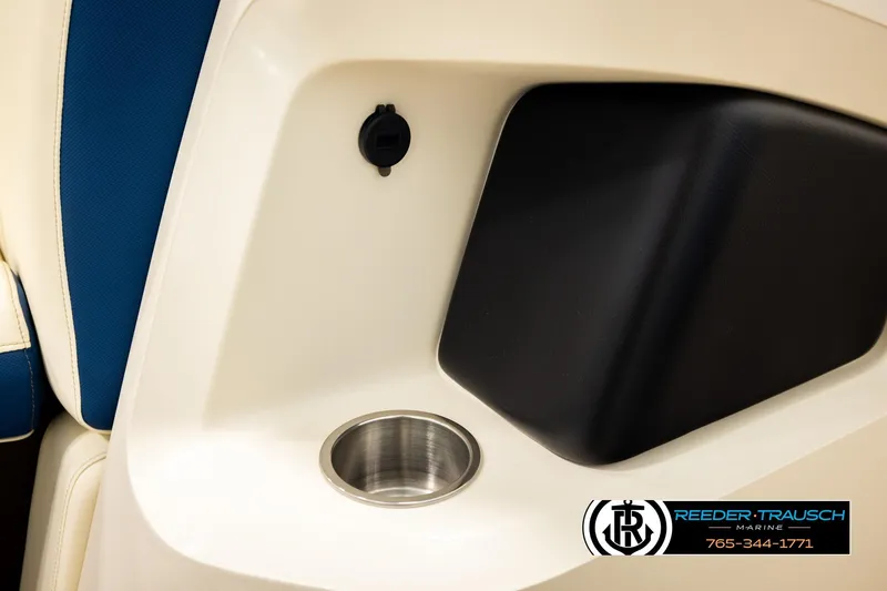 Slide: The Image of 2026 Avalon LSZ QLS boat interior with cup holder and blue seating. - 44