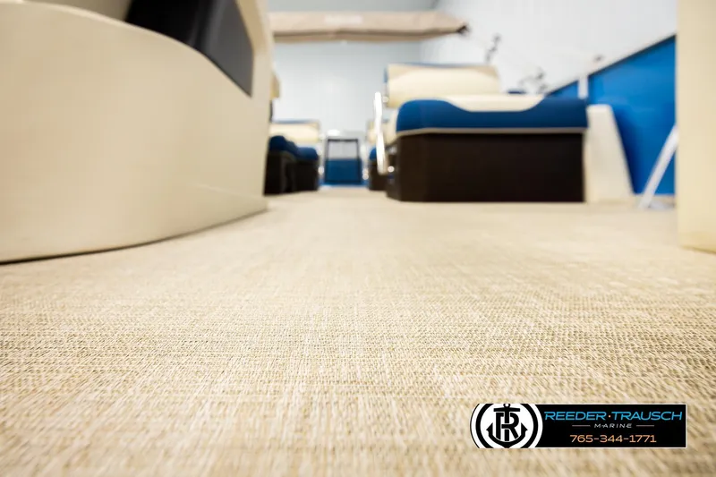 Slide: The Image of 2026 Avalon LSZ QLS boat interior with beige flooring and blue seating. - 46