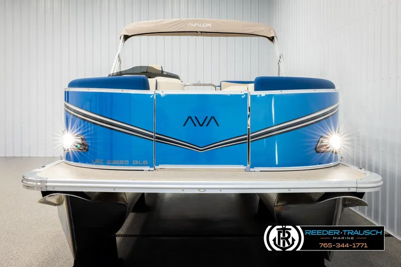 Slide: The Image of 2026 Avalon LSZ QLS pontoon boat with blue exterior and illuminated headlights. - 8