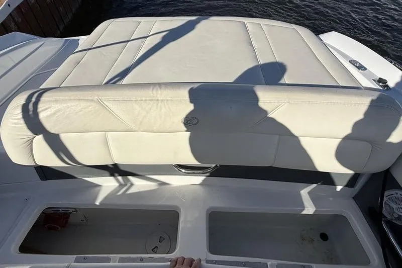 Slide: The Image of Rear seating area of a 2008 Cobalt 202 boat with storage compartments. - 11