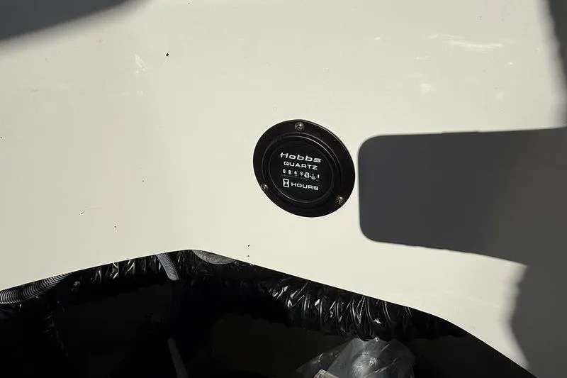 Slide: The Image of Hobbs hour meter on 2008 Cobalt 202 boat dashboard. - 13