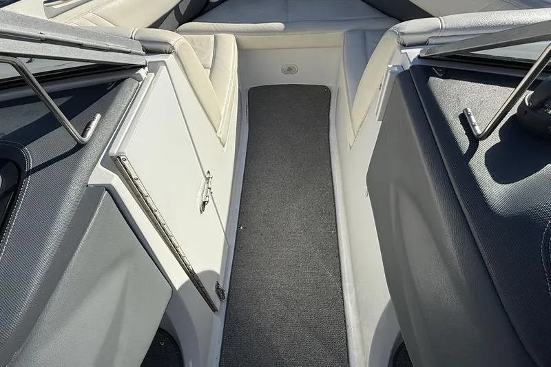 Slide: The Image of Interior view of a 2008 Cobalt 202 boat, featuring seating and storage compartments. - 24