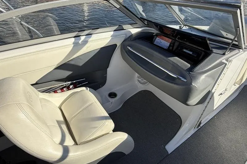 Slide: The Image of Interior of a 2008 Cobalt 202 boat with beige seating and dashboard. - 32