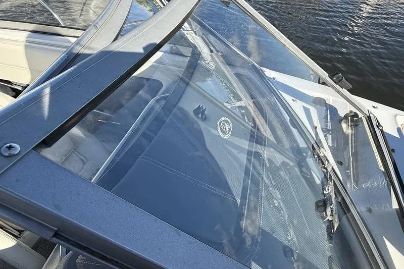Slide: The Image of 2008 Cobalt 202 boat windshield and interior view by the water. - 36