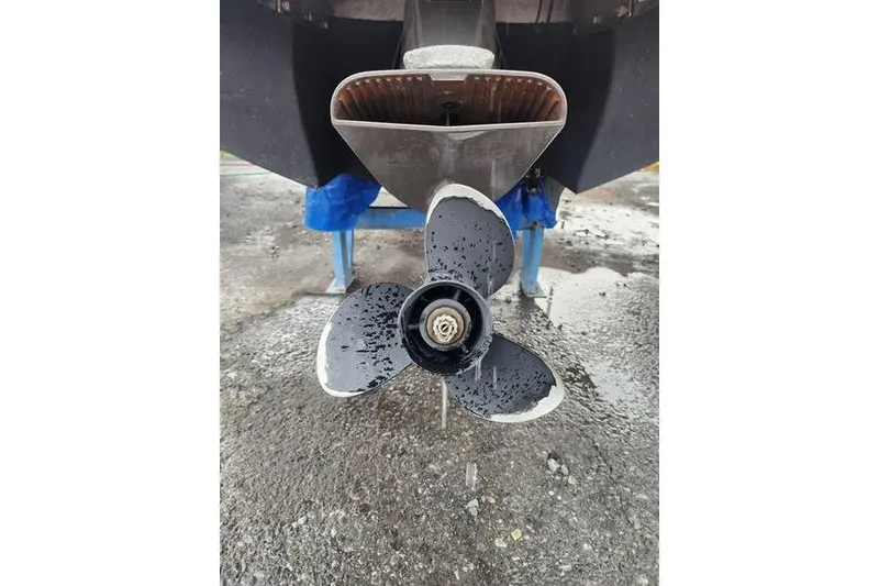 Slide: The Image of 2008 Cobalt 202 boat propeller with water droplets, displayed on a stand. - 46