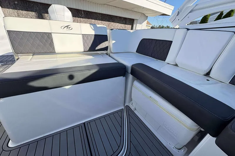 Slide: The Image of Luxurious seating on 2020 Monterey M-65 boat with stylish black and white upholstery. - 11