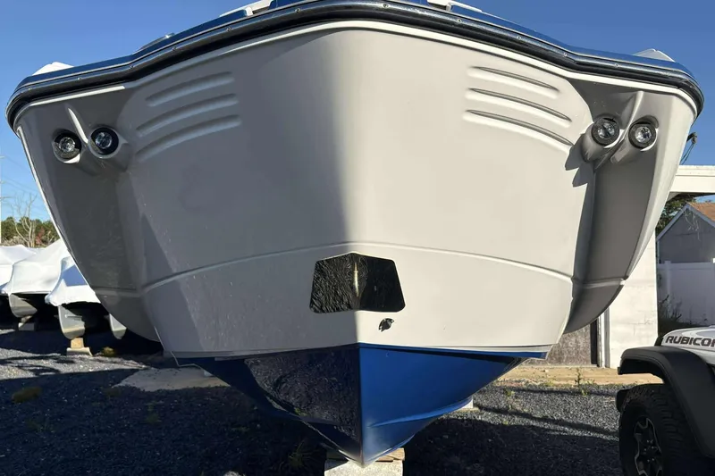 Slide: The Image of 2020 Monterey M-65 boat front view, showcasing sleek design and dual headlights. - 5