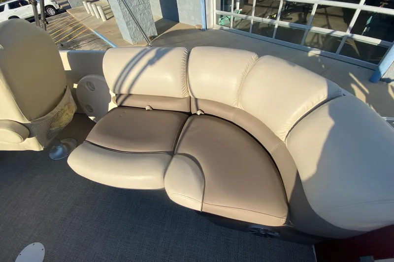Slide: The Image of Luxurious seating on 2018 Hampton 2485 SE boat, featuring beige and brown upholstery. - 13