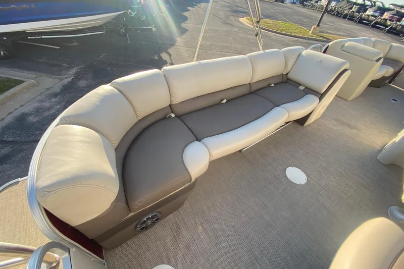 Slide: The Image of 2018 Hampton 2485 SE boat interior with beige and gray cushioned seating. - 14