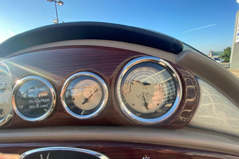 Slide: The Image of Dashboard of 2018 Hampton 2485 SE boat with gauges and controls. - 25