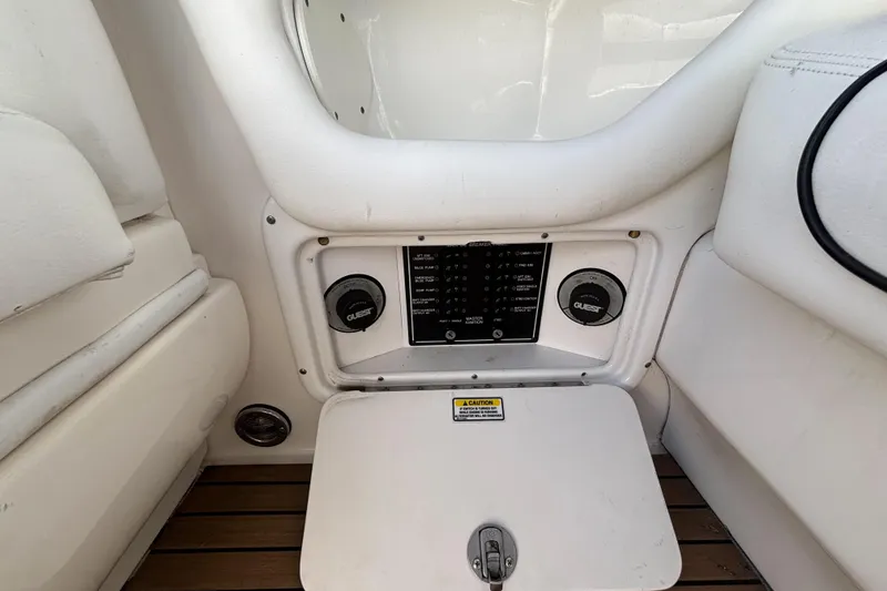 Slide: The Image of 2006 Sea Ray 290 SLX boat control panel with switches and gauges. - 27