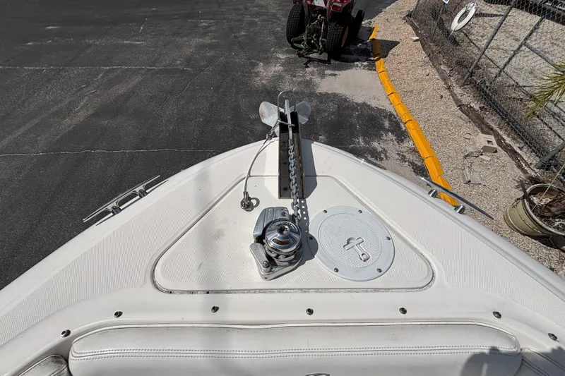 Slide: The Image of Bow of 2006 Sea Ray 290 SLX boat with anchor and chain mechanism. - 47