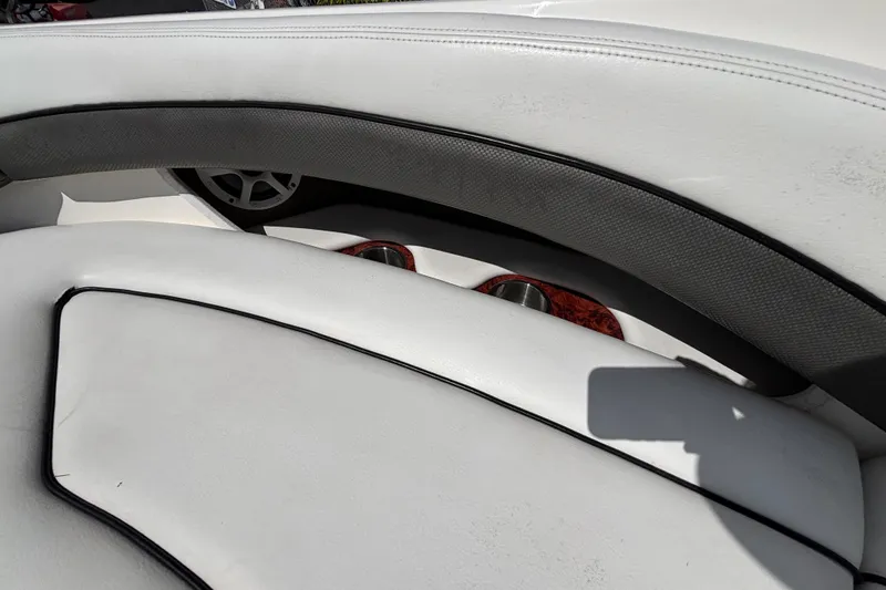 Slide: The Image of White leather seating on a 2006 Sea Ray 290 SLX boat interior. - 54