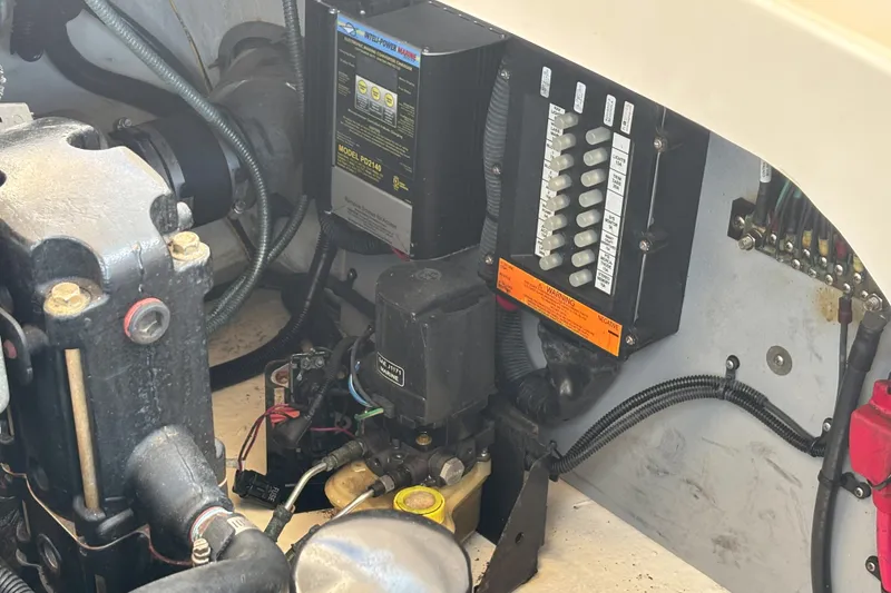 Slide: The Image of Engine compartment of a 2006 Sea Ray 290 SLX boat, showing electrical components and wiring. - 57