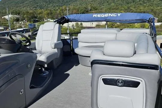 Slide: The Image of 2018 Regency 220 DL3 pontoon boat with spacious seating and modern design. - 7