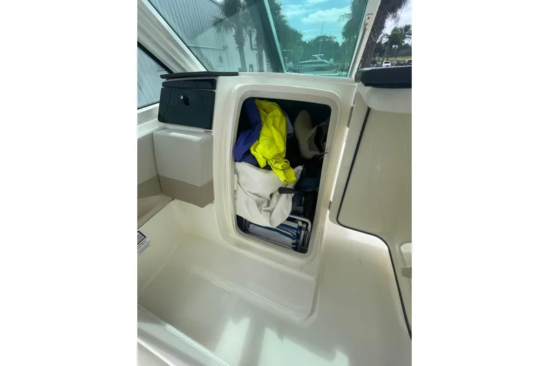 Slide: The Image of 2023 Boston Whaler 280 Vantage boat with spacious seating and sleek design. - 15