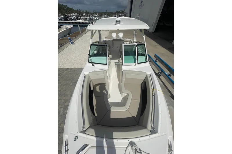 Slide: The Image of 2023 Boston Whaler 280 Vantage engine compartment with open hatch, showcasing internal components. - 16