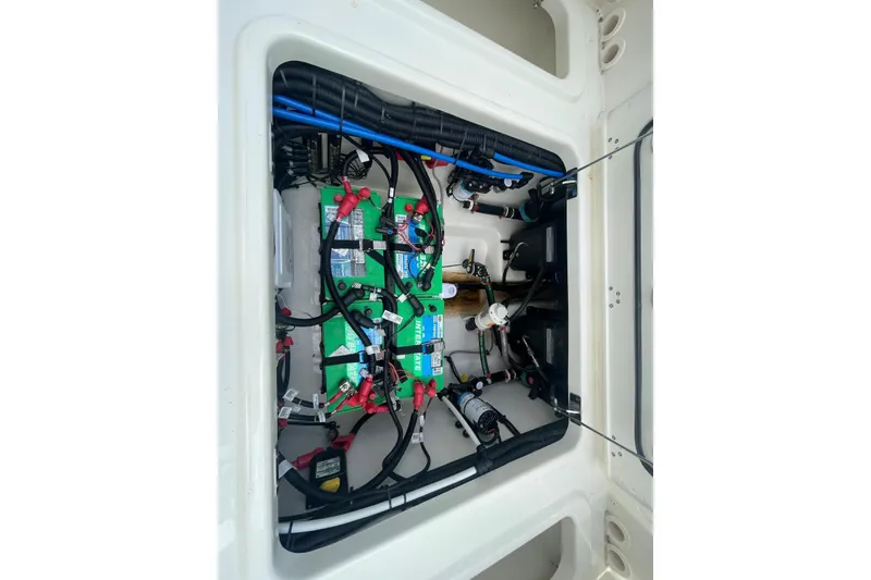 Slide: The Image of Interior of 2023 Boston Whaler 280 Vantage boat, featuring a compact bathroom area. - 18