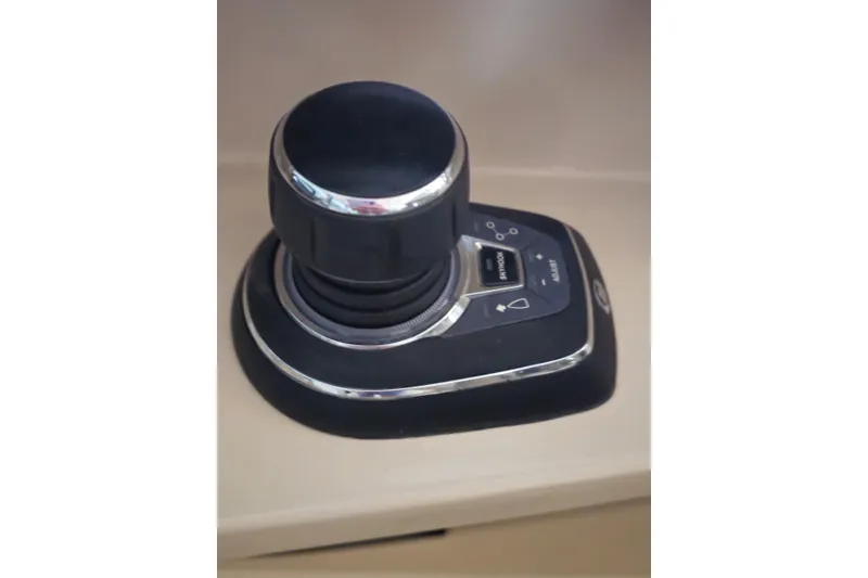Slide: The Image of Joystick control on 2023 Boston Whaler 280 Vantage boat dashboard. - 21