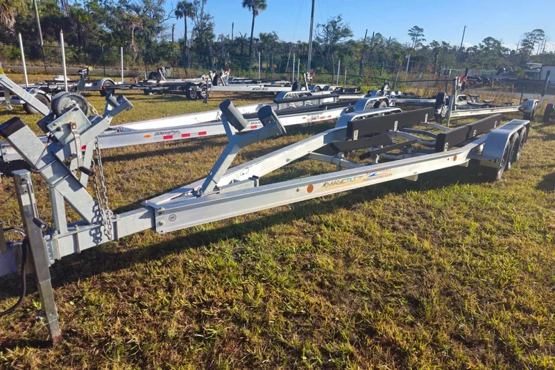 Slide: The Image of Boat trailer for 2023 Boston Whaler 280 Vantage on grassy lot. - 23