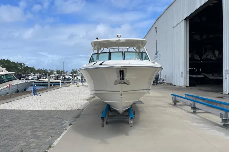 Slide: The Image of 2023 Boston Whaler 280 Vantage boat at marina, front view, clear sky background. - 5