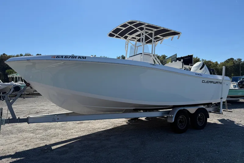 Slide: The Image of 2023 Clearwater boat on trailer under clear blue sky. - 19