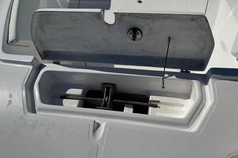 Slide: The Image of Open storage compartment on 2023 Clearwater boat, showing anchor and cable. - 7
