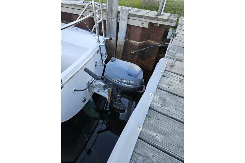 Slide: The Image of Catalina Capri 25 sailboat with Yamaha outboard motor docked, 1981 model. - 9