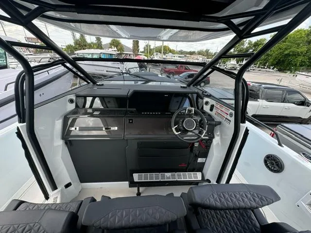 Slide: The Image of 2024 BRABUS Shadow 1000 ST boat cockpit with modern steering and controls. - 10
