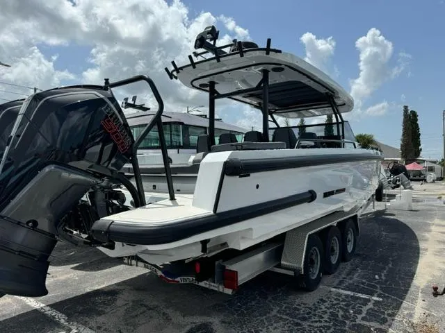 Slide: The Image of 2024 BRABUS Shadow 1000 ST boat on trailer, rear view, sunny day. - 2
