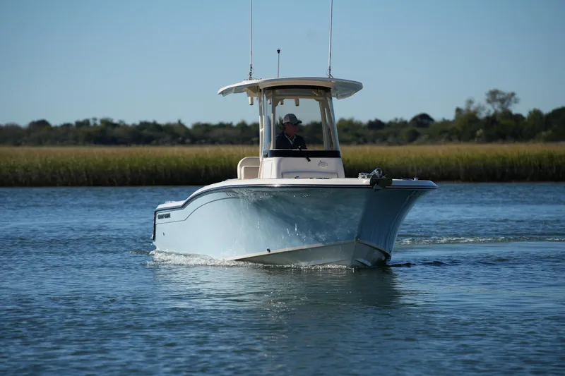 Slide: The Image of 2024 Grady-White Fisherman 236 boat cruising on calm water. - 15