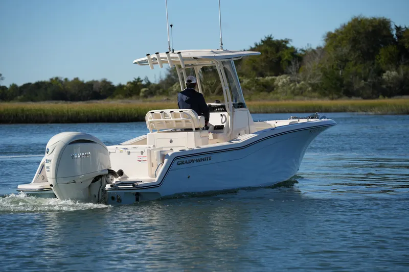 Slide: The Image of 2024 Grady-White Fisherman 236 boat cruising on a calm waterway. - 17