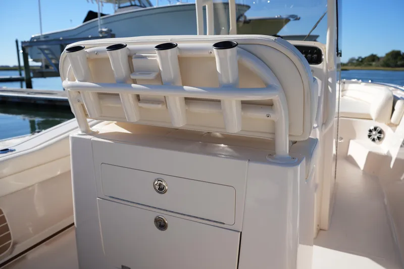 Slide: The Image of 2024 Grady-White Fisherman 236 boat interior with rod holders and storage compartments. - 21