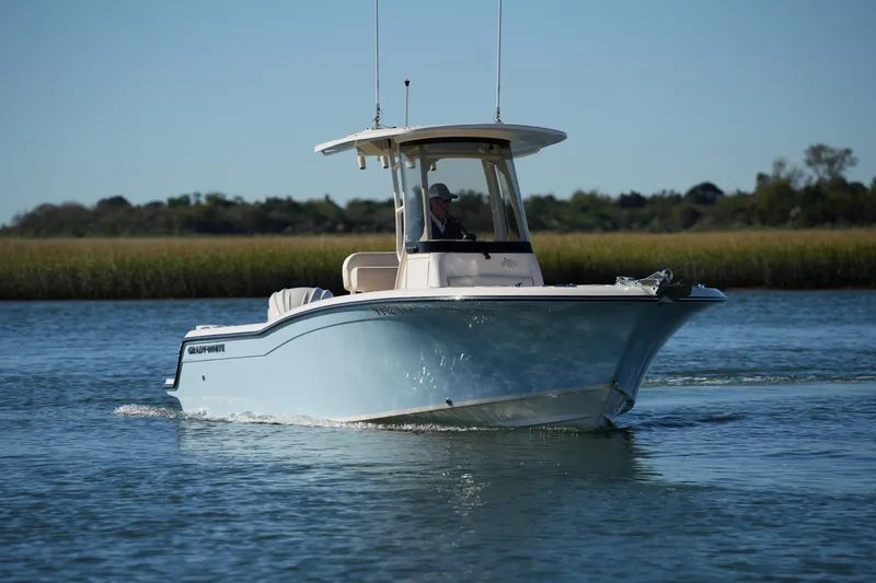 Slide: The Image of 2024 Grady-White Fisherman 236 boat cruising on calm water. - 3