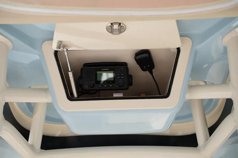 Slide: The Image of 2024 Grady-White Fisherman 236 boat console with Garmin radio and microphone. - 32