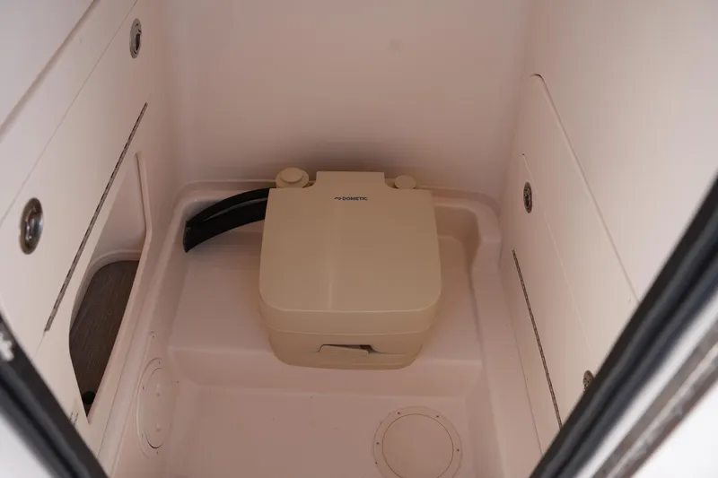 Slide: The Image of 2024 Grady-White Fisherman 236 boat interior with portable toilet. - 33