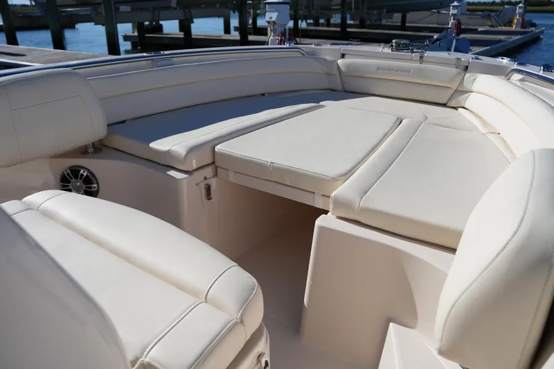 Slide: The Image of 2024 Grady-White Fisherman 236 boat interior with cushioned seating and sleek design. - 34