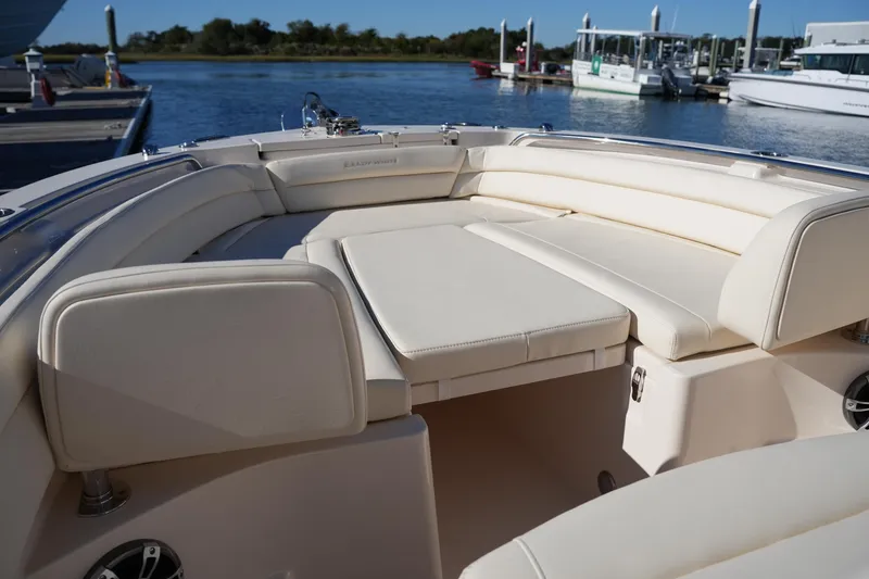 Slide: The Image of 2024 Grady-White Fisherman 236 boat interior with cushioned seating at the dock. - 35