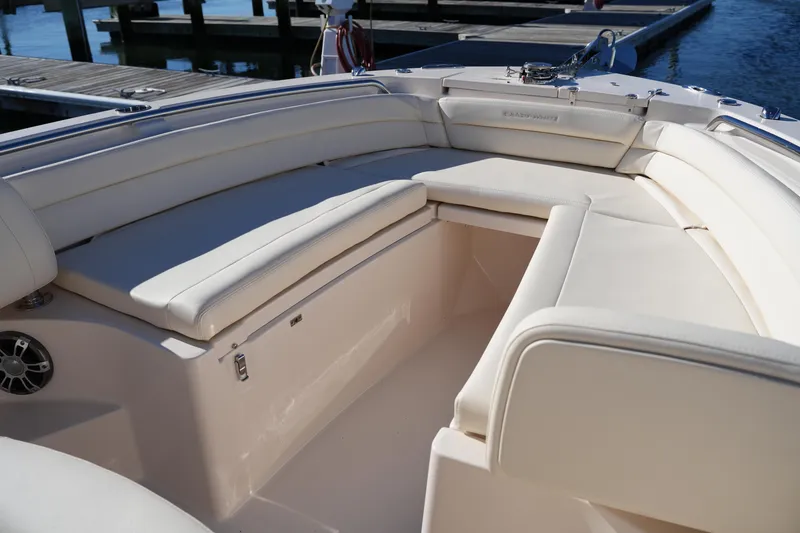 Slide: The Image of 2024 Grady-White Fisherman 236 boat interior with cushioned seating and storage. - 37