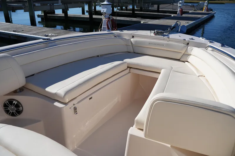 Slide: The Image of 2024 Grady-White Fisherman 236 boat interior with cushioned seating at dock. - 39