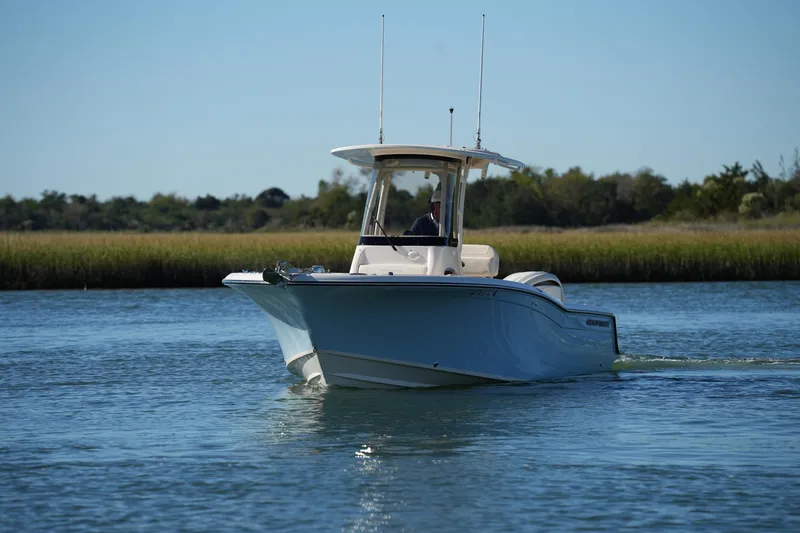 Slide: The Image of 2024 Grady-White Fisherman 236 boat cruising on calm water. - 5