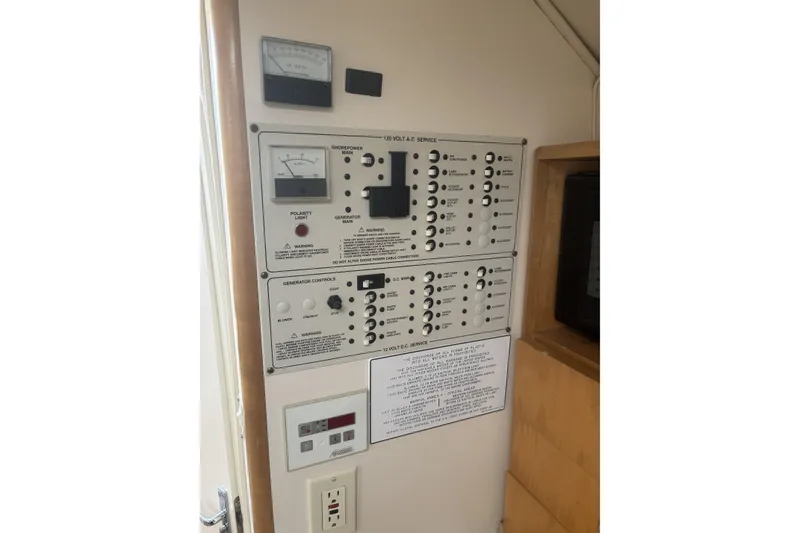Slide: The Image of Electrical control panel in a 2000 Larson Cabrio 330 Mid Cabin boat. - 22