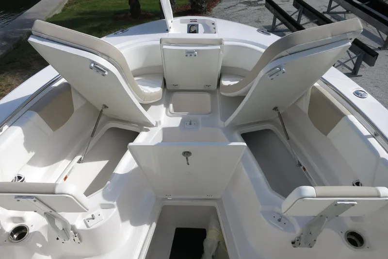 Slide: The Image of 2025 Robalo R250 Center Console boat interior with open storage compartments. - 19